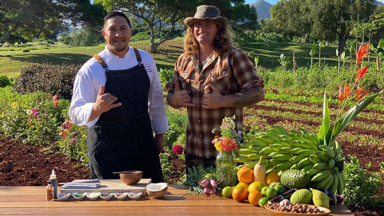 Chef Zach Cummings (left) cooks with food grown by farmer Cody Meyer (right).