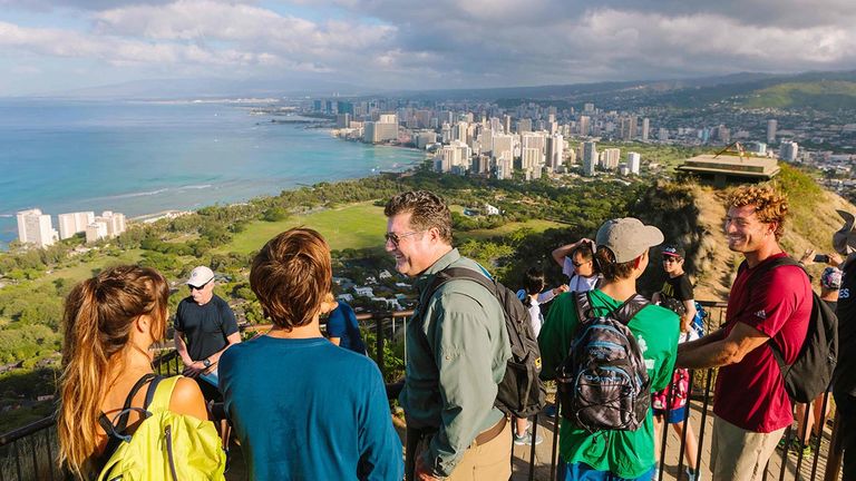 During Hawaii Forest & Trail's Honolulu Heights tour, guides share insights and inspirational views from the Diamond Head summit