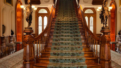 Clients can climb a grand koa wood staircase during a virtual tour of Iolani Palace. // © 2017 Friends of Iolani Palace