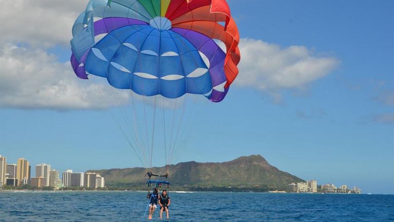 Parasailing takes clients up, up and away above the waters of Waikiki.