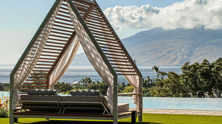 The infinity-edge pool offers ocean views.