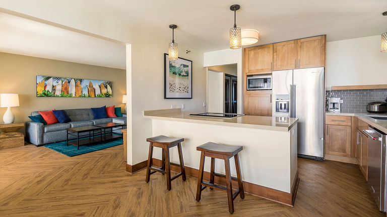 Each Aston Waikiki Beach Tower residence features a full kitchen and separate living room with island-inspired furnishings. Credit: 2019 Aqua-Aston Hospitality