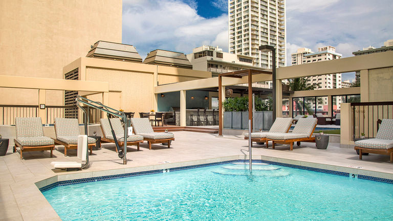 A pool, lounge chairs, fire pits, barbecues and ocean views await guests on Aston Waikiki Beach Tower's new fourth-floor deck.