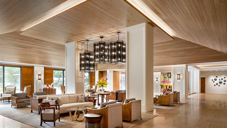 A stylish, airy lobby welcomes guests to Halepuna.