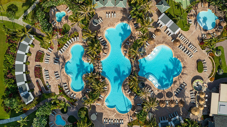 The hotel’s pool is in the shape of a fleur-de-lis.