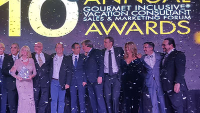 Hall of Fame award winner Sally Smith of Travel Smith (with award) poses on stage with Karisma’s executive team and representatives of El Dorado Spa Resorts, Generations Resorts, and Hidden Beach Resort by Karisma. // © 2018 Karisma Hotels and Resorts