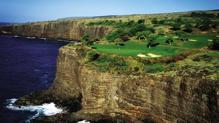 Statuesque sea cliffs flank the captivating 12th hole of Lanai's Manele Course.