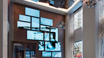 In the hotel lobby, a 15-foot-high video art wall showcases the works of artists-in-residence. // © 2014 The Quin