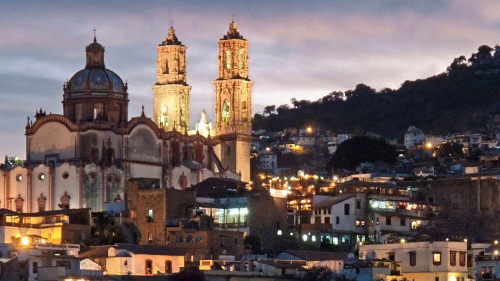 Evening over the famous Baroque church of Santa Prisca in Taxco, Mexico. The colonial town of Taxco is a UNESCO World Heritage Site. // © 2013 istock: stockcam Fe