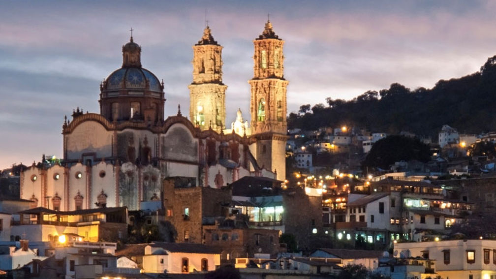 Evening over the famous Baroque church of Santa Prisca in Taxco, Mexico. The colonial town of Taxco is a UNESCO World Heritage Site. // © 2013 istock: stockcam Fe