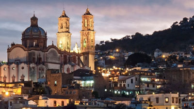 Evening over the famous Baroque church of Santa Prisca in Taxco, Mexico. The colonial town of Taxco is a UNESCO World Heritage Site. // © 2013 istock: stockcam Fe