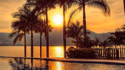 A poolside and lagoonside sunset at Lago Escondido Hotel Boutique // © 2014 Visit Nayarit 2