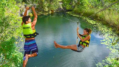 Go ziplining in the jungle with a Xenotes Oasis Maya excursion. // © 2016 Oasis Xenotes Maya