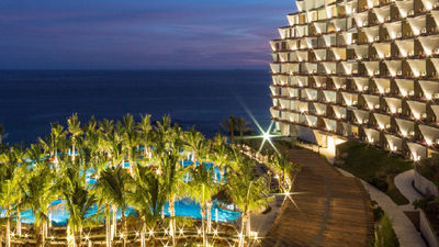 The resort’s curved walls are meant to resemble sails. // © 2017 Grand Velas Los Cabos 2