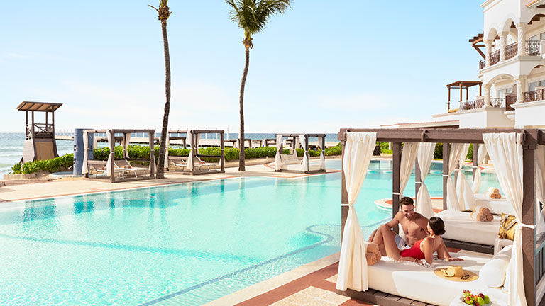 The hotel features an expansive pool area with plenty of cabanas.