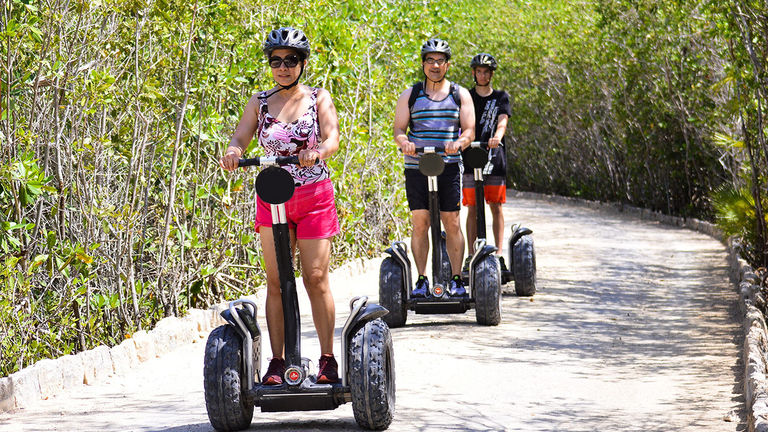 Guests use Segways to tour the resort’s organic farm.