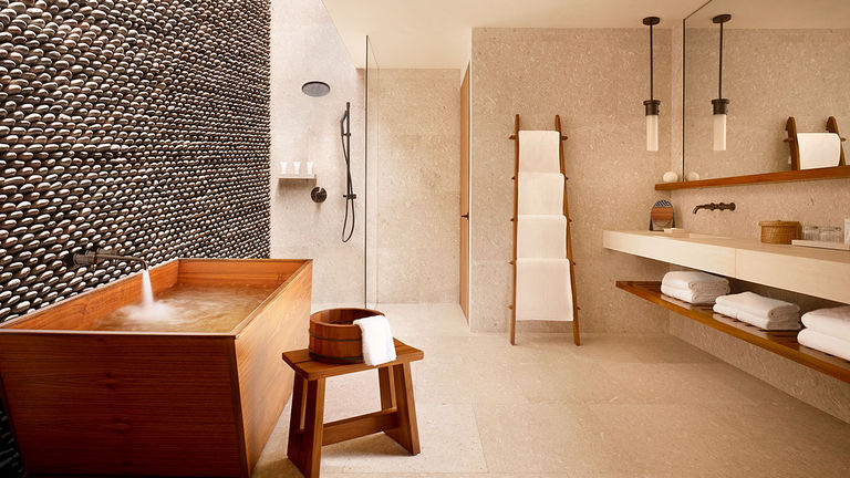 Bathrooms at the 200-room property include features such as teak onsen (Japanese hot spring) soaking tubs.