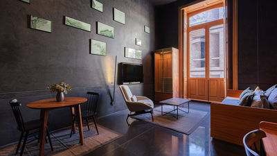 Guestrooms feature eye-catching interplay between light and dark.