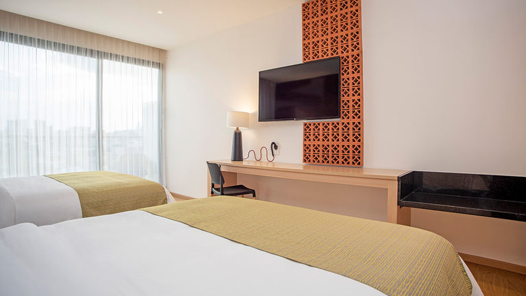 A guestroom at Voco Guadalajara Neruda, which opened recently in Providencia in Guadalajara