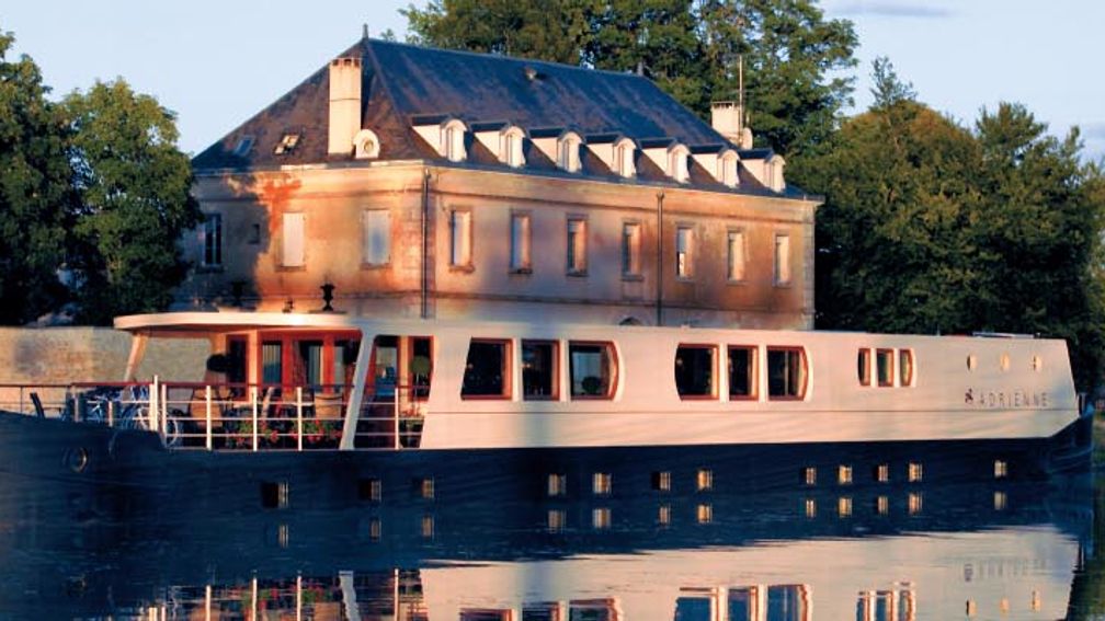 Clients can enjoy the scenery from the barge’s open-air deck. // © 2013 French Country Waterways 3