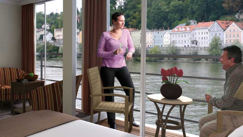 An AmaBella balcony suite provides a charming view of local scenery. // © 2013 Ama Waterways F