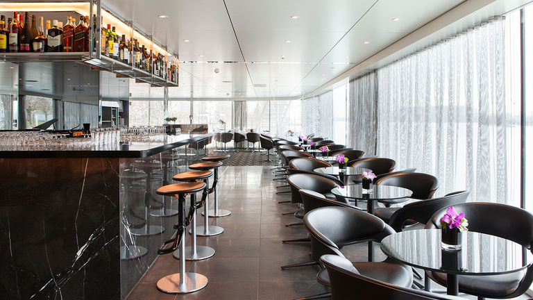 Cruisers can chat with shipmates, play board games and peruse the library in Panorama Lounge and Bar.