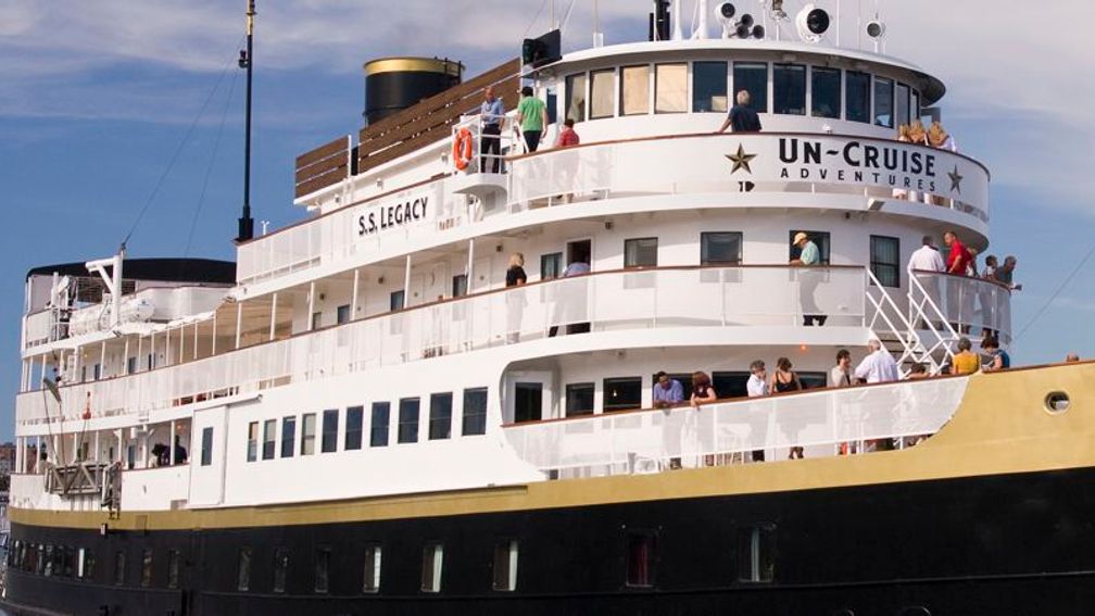 Legacy’s godmother, company controller JeeSook Kutz, christened the ship with a bottle of champagne. // © 2013 Un-Cruise Adventures F