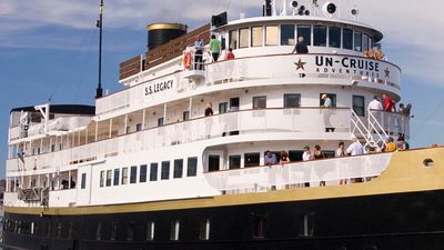 Legacy’s godmother, company controller JeeSook Kutz, christened the ship with a bottle of champagne. // © 2013 Un-Cruise Adventures F