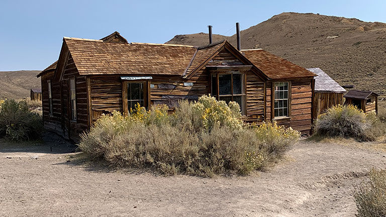 At Bodie State Historic Park, travelers can peer into original structures that still house the remnants of past inhabitants.
