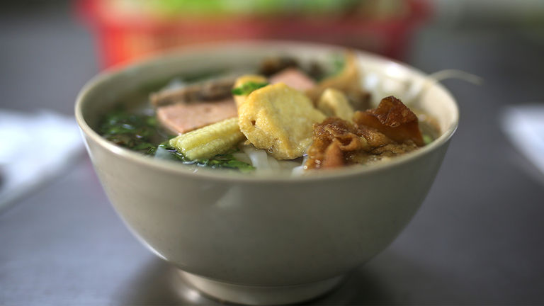 Meals range from vegetarian pho served at a local cafe to multicourse meals at high-end restaurants.