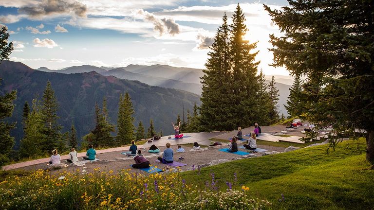 Yogis can practice at the top of Aspen Mountain during the summer months.