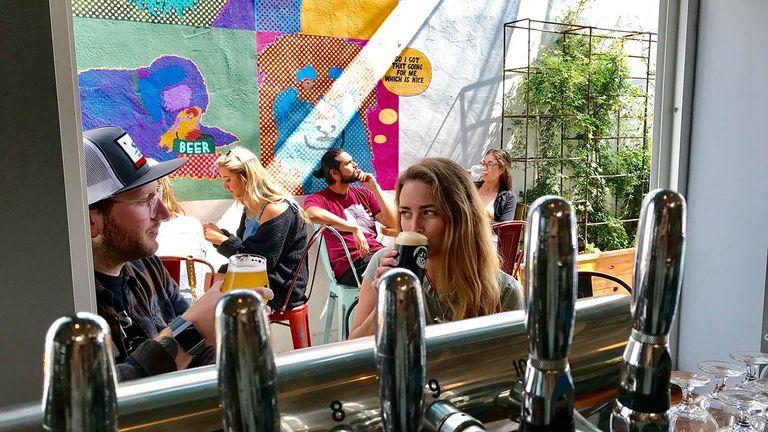 Enjoy craft beer and eats such as rock fish tacos at Lama Dog Tap Room + Bottle Shop.