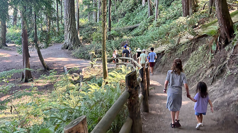 The writer and her crew walk in Deception Pass State Park.
