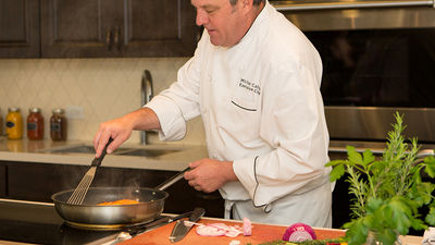 Cairns gives a cooking demonstration in the property’s new Chef’s Kitchen & Herb Garden. // © 2015 Omni Scottsdale Resort & Spa at Montelucia