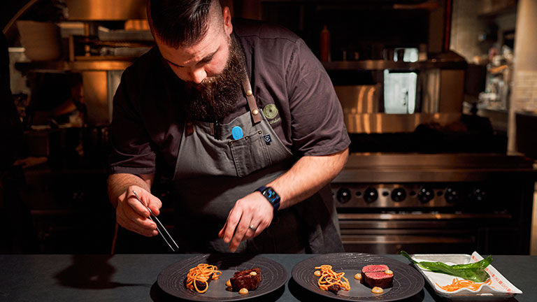 Executive chef Brandon Cunningham serves fine-dining dishes at Social Haus.