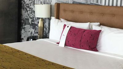 Guestrooms feature minimal design with a few splashes of color. // © 2017 Emma Weissmann