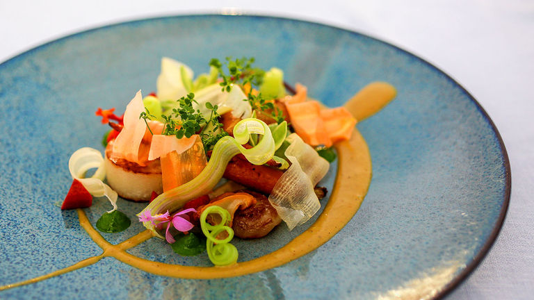 One of Studio’s innovative, plant-based dishes from its Garden Menu includes a root vegetable confit with coconut curry.