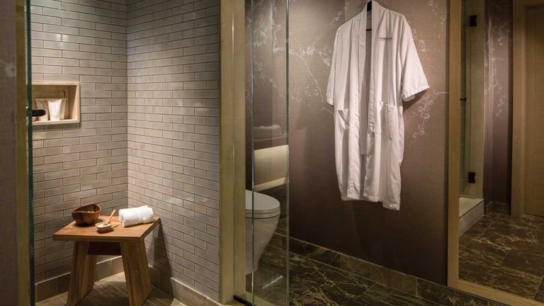 Guestroom bathrooms feature Italian marble flooring, a spacious rain shower and Natura Bisse bath products; some room categories also have a bathtub.