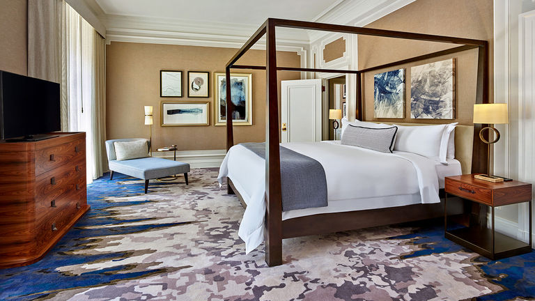 Rooms and suites at Palace Hotel feature high ceilings and city views.