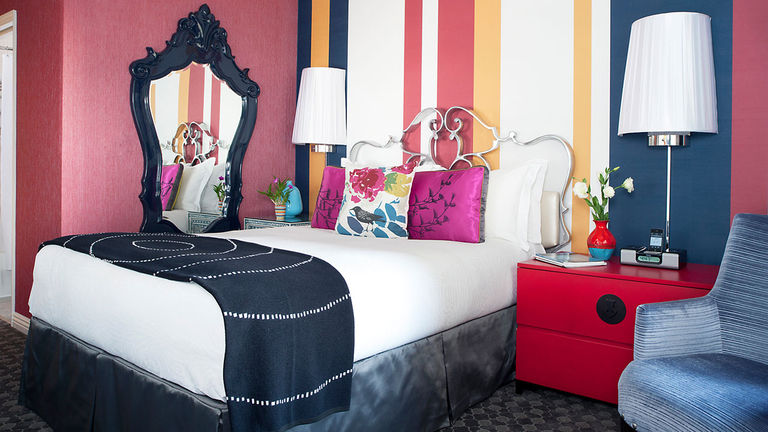 Guestrooms feature a bold color palette.