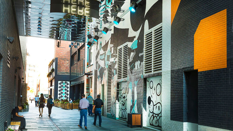 Some guestrooms look out to the lively Alley at the Dairy Block.