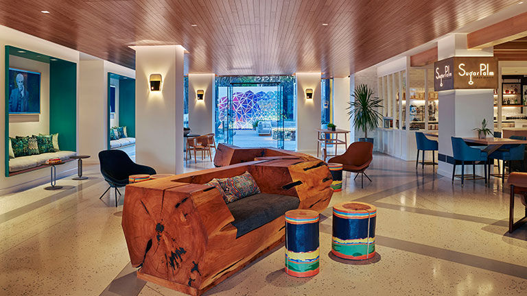 The renovated lobby is anchored by a two-ton driftwood bench to channel the hotel’s beachy location.