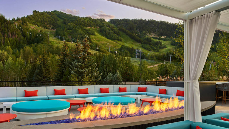 Take in the sunset glow of Aspen and its rolling slopes from rooftop hot spot Wet Deck.