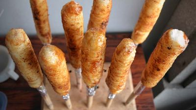 Eating Japanese Rice On A Stick