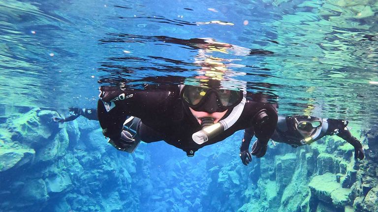 The author and her family taking the "iconic Silfra Fissure photo”
