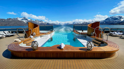 The ship’s infinity pool and whirlpools are ideal spots for scenic views.
