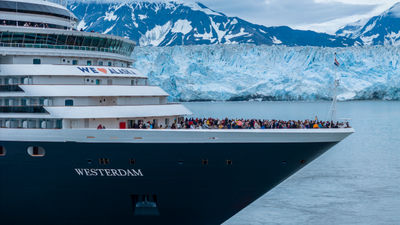 Westerdam and its guests sailing in front of Hubbard Glacier