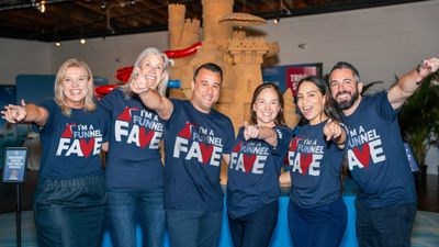 Carnival crew members in "Funnel Fave" t-shirts
