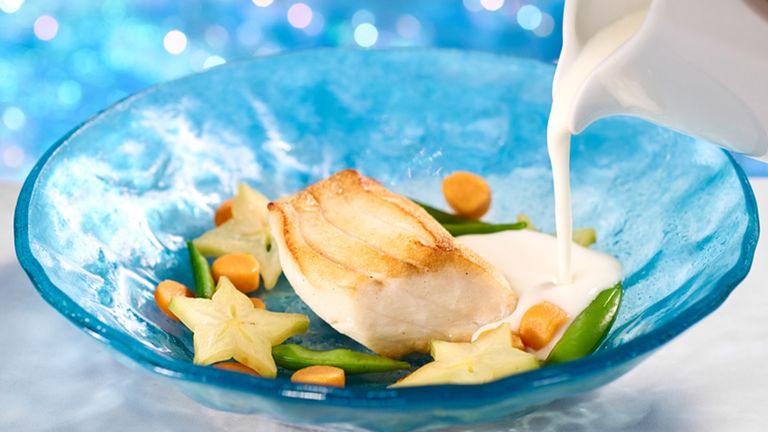 The pan-seared seabass at Atlantic is served with carrot mochi, sugar snap peas, lemongrass broth and starfruit.