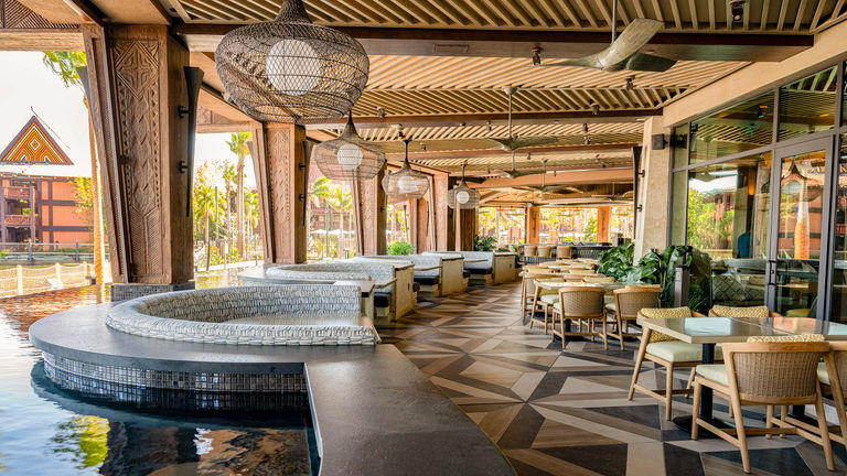 Wailulu Bar & Grill with Walt Disney World’s first all-electric kitchen features outdoor seating surrounded by an infinity fountain.